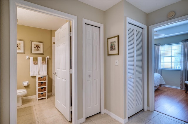 bathroom featuring toilet and tile patterned flooring