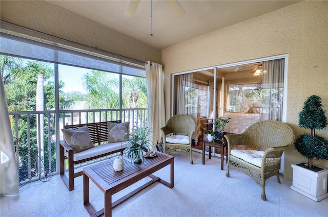 sunroom featuring ceiling fan