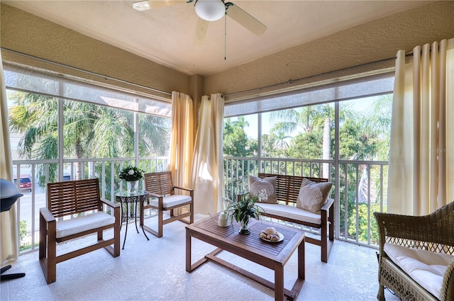 sunroom featuring ceiling fan