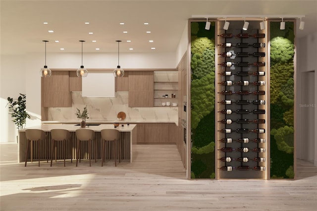 wine cellar featuring light wood-type flooring