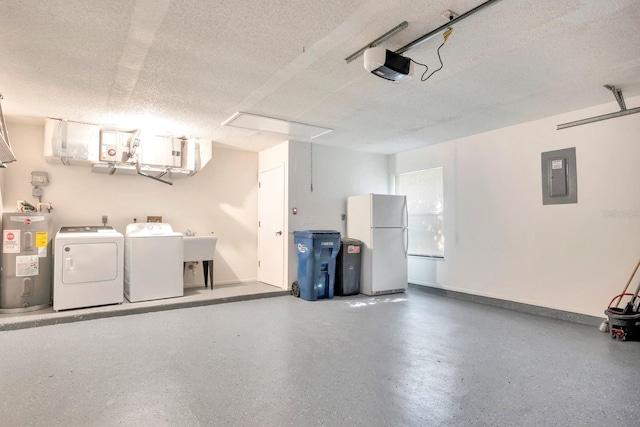 garage with a garage door opener, electric panel, white refrigerator, separate washer and dryer, and water heater