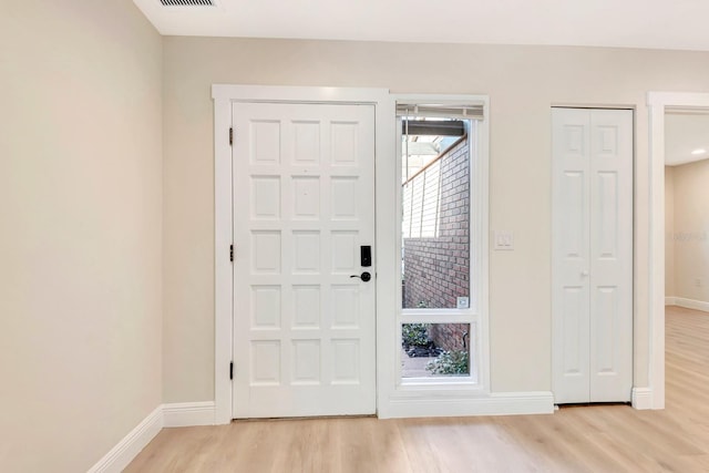 entrance foyer featuring light hardwood / wood-style floors