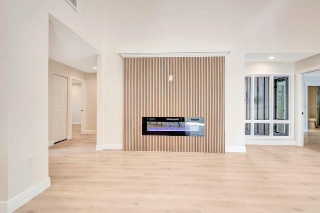 unfurnished living room featuring light hardwood / wood-style flooring