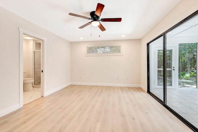 unfurnished room with ceiling fan and light hardwood / wood-style floors