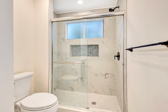 bathroom with toilet and walk in shower