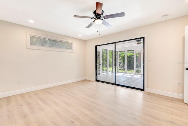 spare room with ceiling fan and light hardwood / wood-style floors