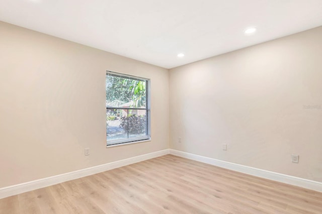 unfurnished room featuring light wood-type flooring