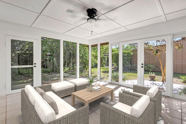 sunroom / solarium featuring ceiling fan and a healthy amount of sunlight