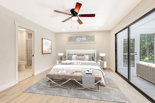 bedroom featuring ensuite bath, access to outside, light hardwood / wood-style flooring, and ceiling fan