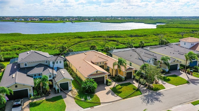 birds eye view of property with a water view