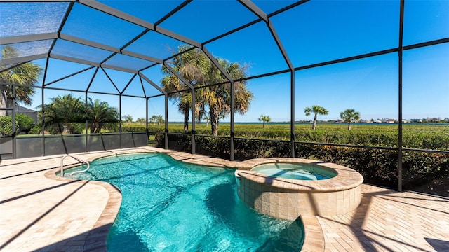 view of swimming pool featuring a lanai, an in ground hot tub, and a patio