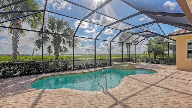 view of swimming pool featuring a patio area, an in ground hot tub, and glass enclosure