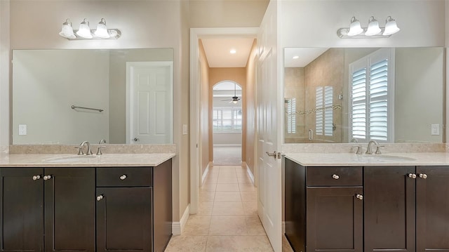 bathroom featuring tile patterned floors, ceiling fan, and vanity