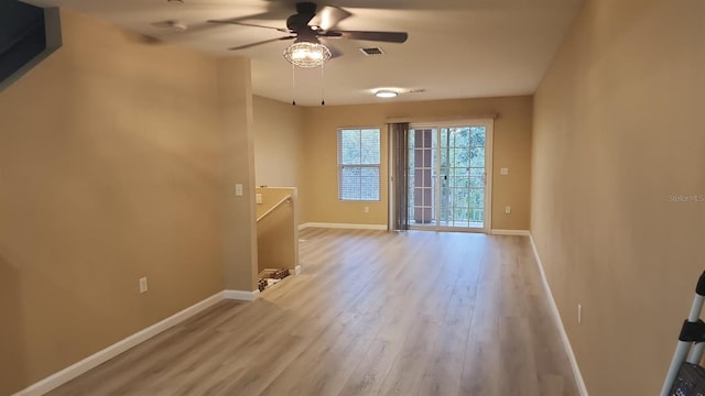 unfurnished room featuring ceiling fan and light hardwood / wood-style floors