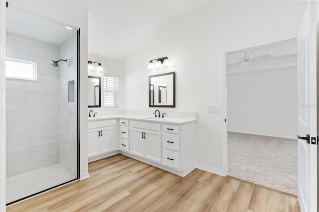 bathroom with wood-type flooring, vanity, plenty of natural light, and ceiling fan