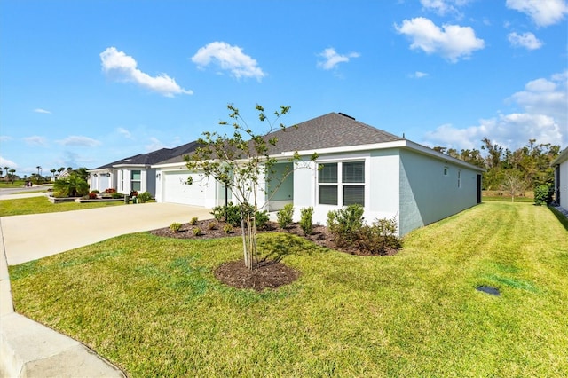 view of front of house with a garage and a front lawn