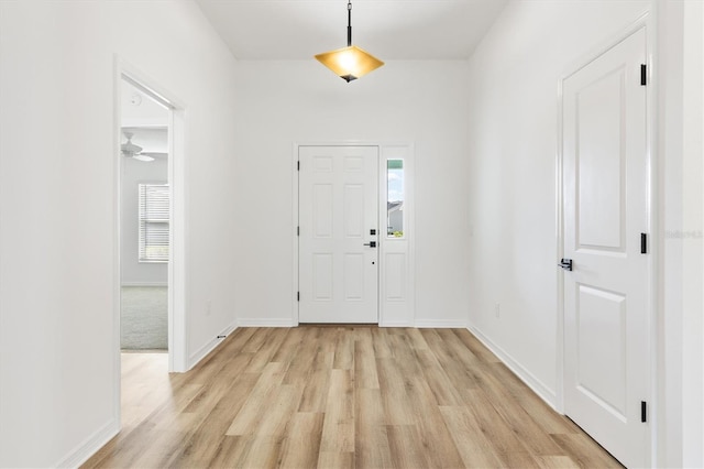 entryway featuring light hardwood / wood-style flooring and ceiling fan