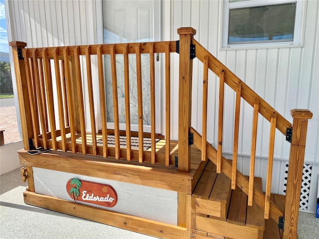 stairs featuring carpet flooring