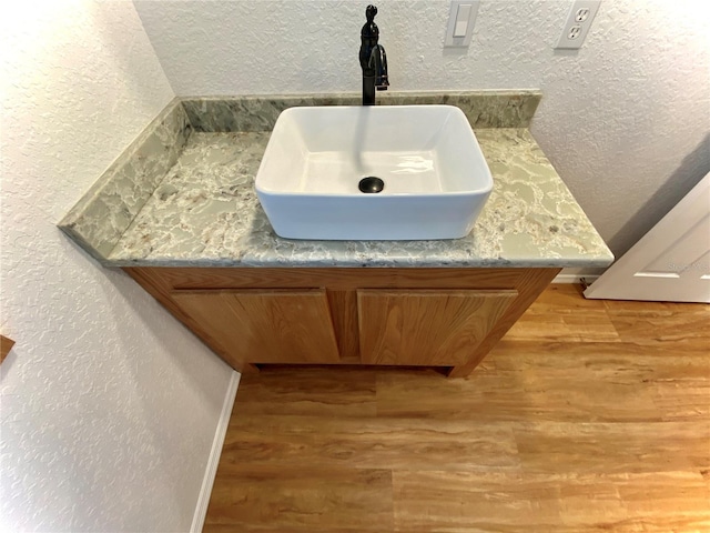 bathroom featuring hardwood / wood-style floors and sink