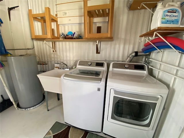 clothes washing area with separate washer and dryer