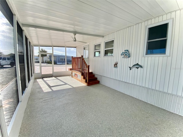 unfurnished sunroom with wood ceiling