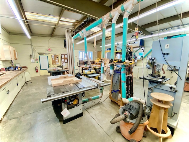 interior space with concrete flooring and a workshop area