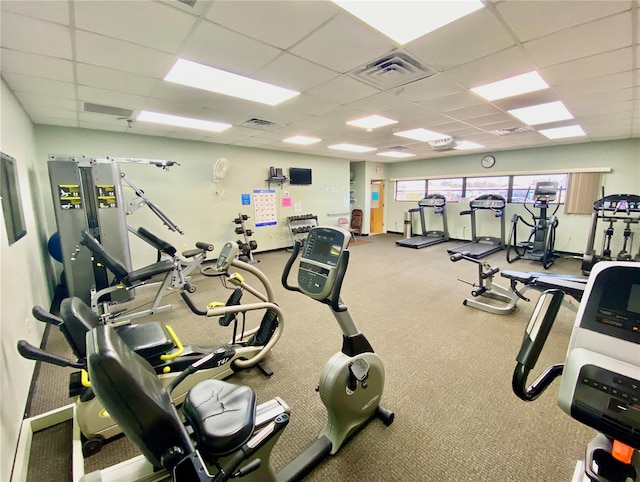 workout area with a drop ceiling and carpet floors