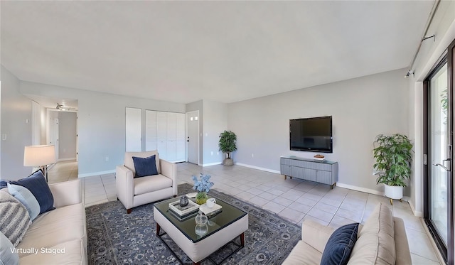 living room with tile patterned floors and ceiling fan