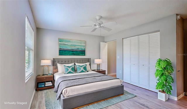 bedroom featuring wood-type flooring, a closet, and ceiling fan