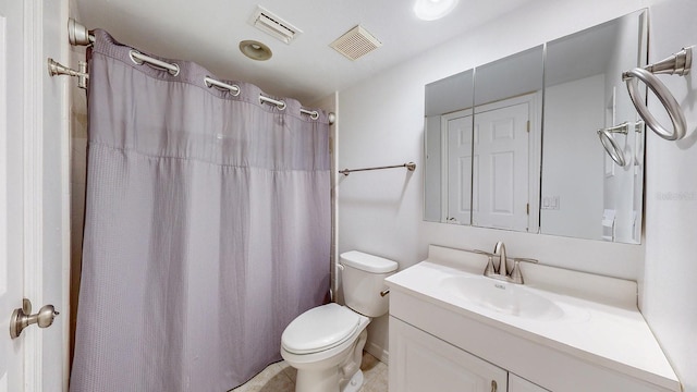 bathroom with a shower with shower curtain, vanity, and toilet