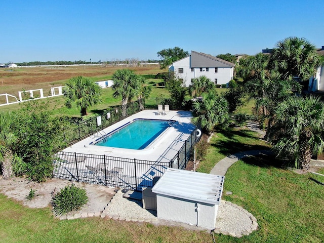 view of pool with a rural view and a patio