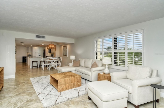 living room featuring a textured ceiling