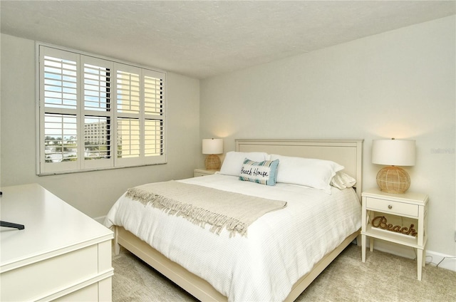 carpeted bedroom with a textured ceiling