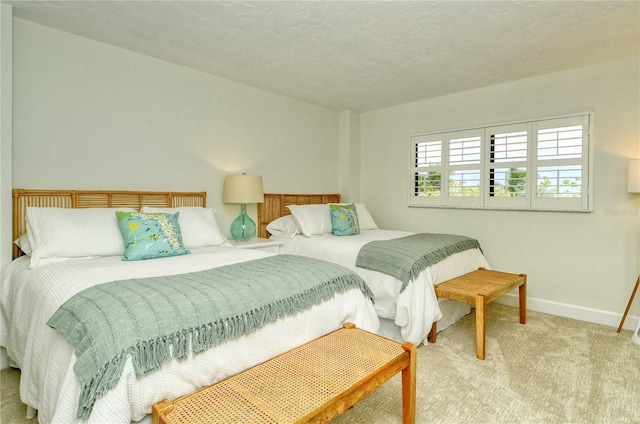 carpeted bedroom with a textured ceiling