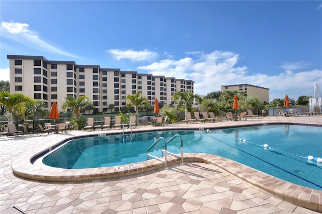 view of swimming pool with a patio area