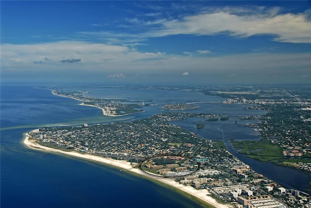 drone / aerial view featuring a beach view and a water view