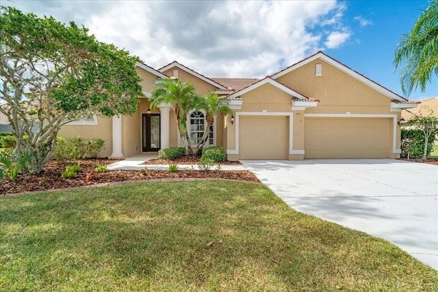 view of front of property featuring a garage and a front lawn