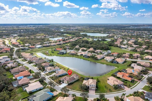 drone / aerial view with a water view