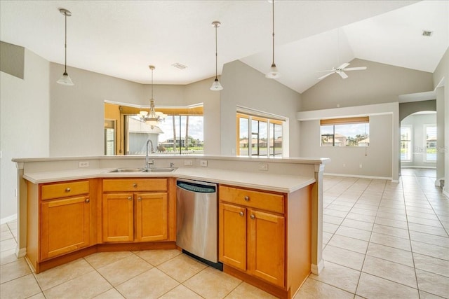 kitchen with dishwasher, light tile patterned floors, and a healthy amount of sunlight