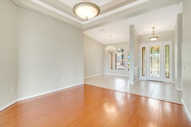 entryway featuring light hardwood / wood-style flooring and a notable chandelier