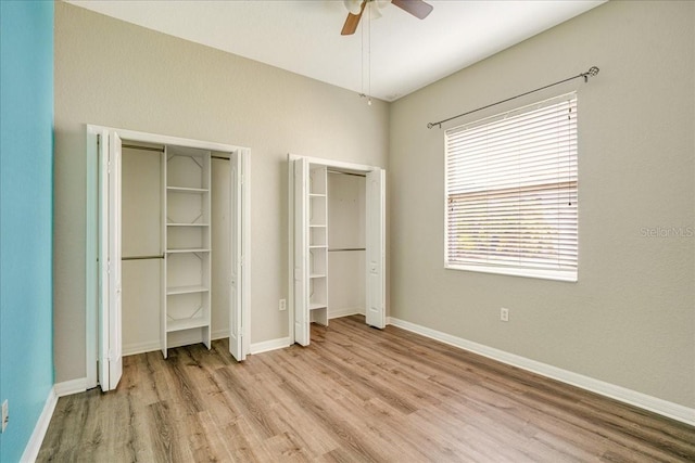 unfurnished bedroom with ceiling fan and light wood-type flooring