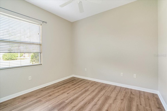 spare room featuring ceiling fan and light hardwood / wood-style floors