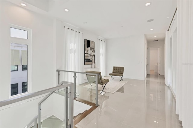 corridor featuring light tile patterned floors