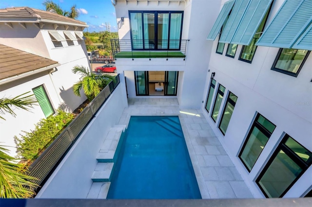 view of pool featuring a patio area