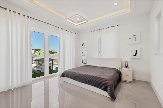 tiled bedroom with a raised ceiling