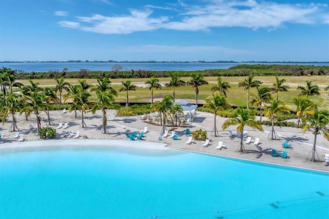 view of pool with a water view