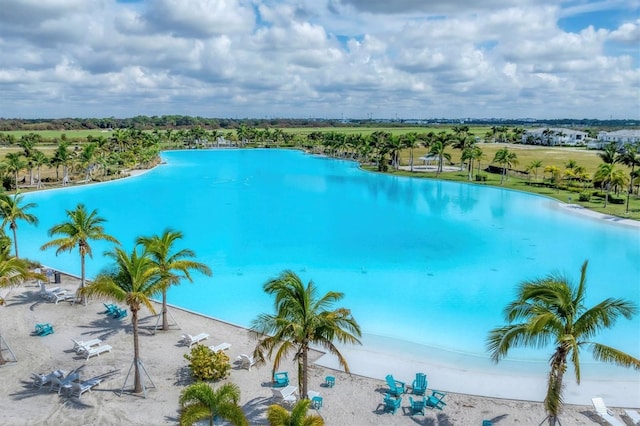 view of pool featuring a water view