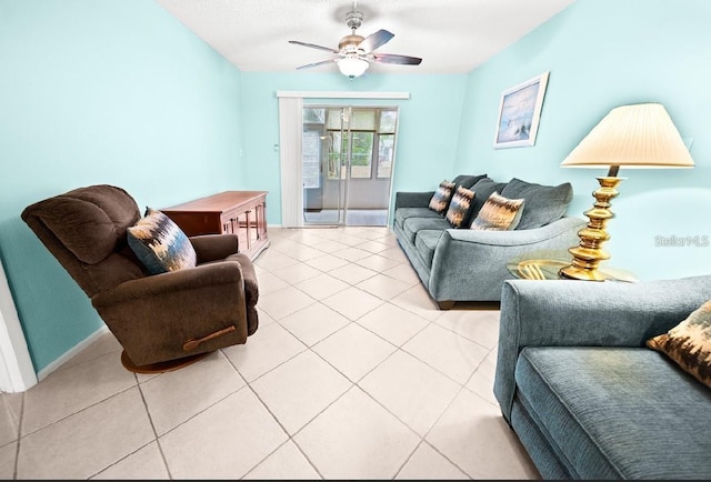 living room with ceiling fan and light tile patterned flooring