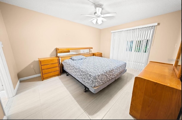 3532 Lake Bayshore Dr Unit K117, Bradenton, FL 34205 - bedroom featuring a textured ceiling and ceiling fan