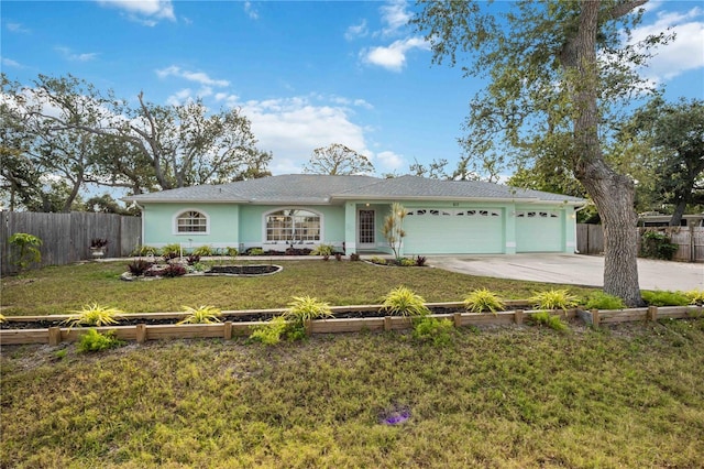 ranch-style home with a garage and a front lawn